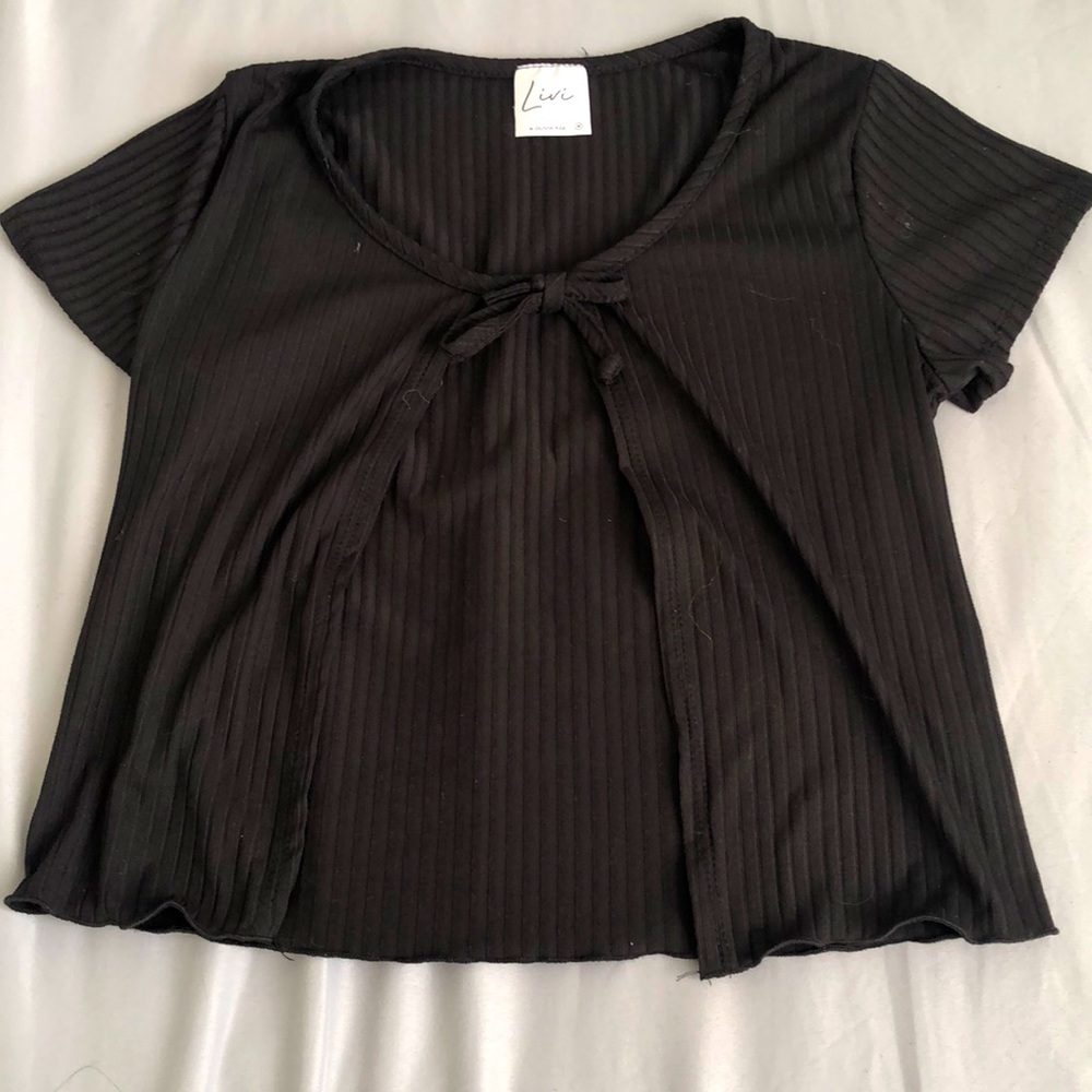 This is a black cotton middle open crop top
